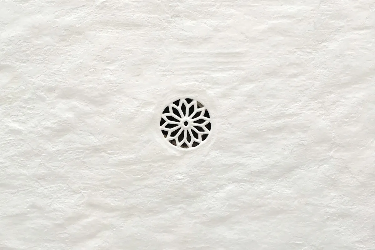 Geometric pattern carved into white paper